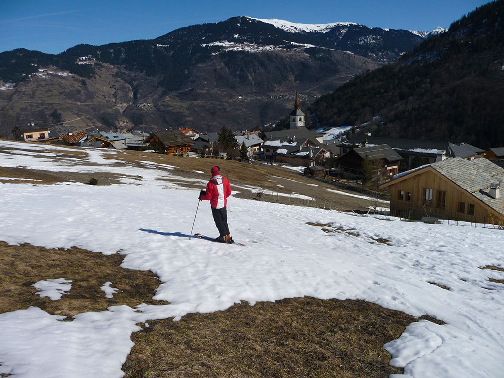 View of the village of Les Allues in March. Melting snow